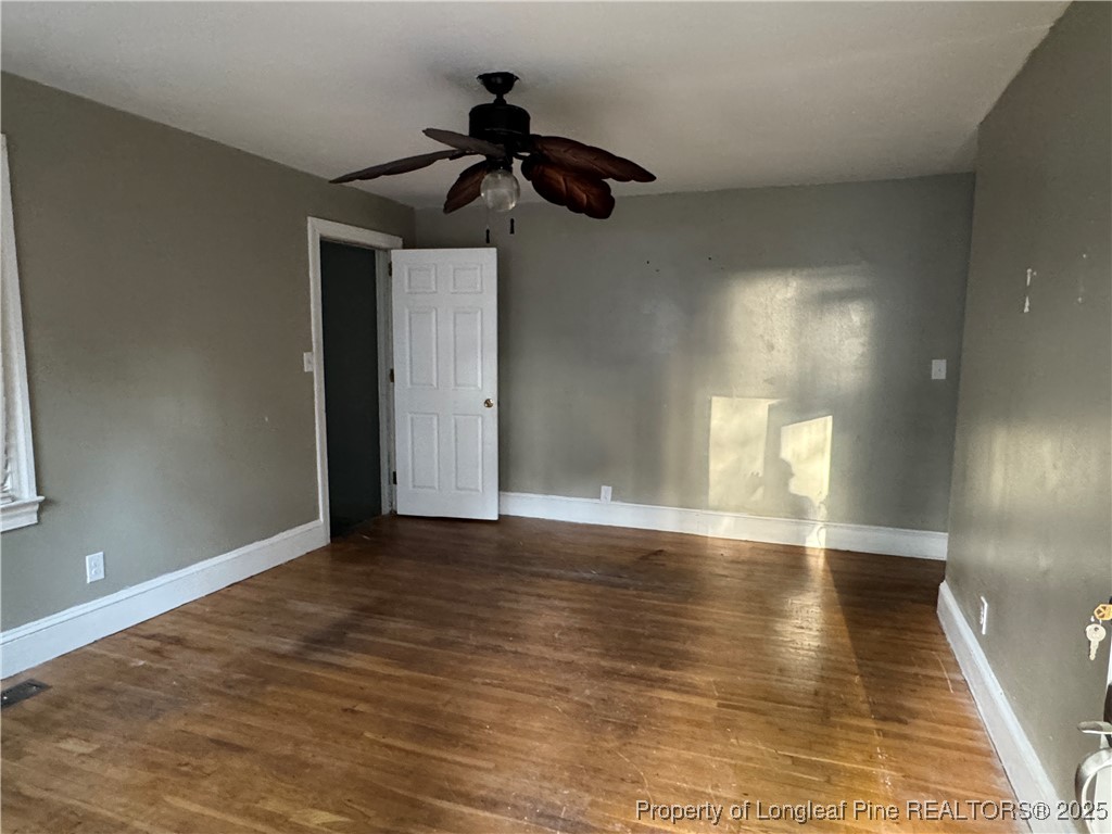 116 North Wright Street Raeford, NC 28376 - Photo 2 of 13 a view of empty room with wooden floor