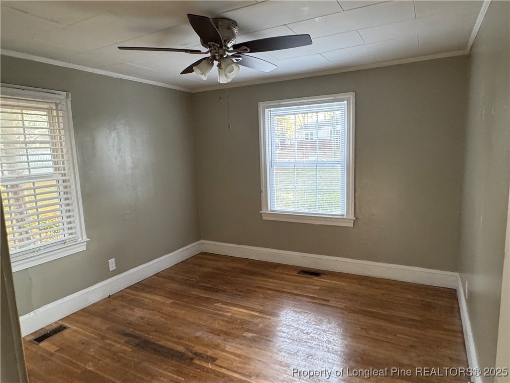 116 North Wright Street Raeford, NC 28376 - Photo 4 of 13 a view of an empty room and window