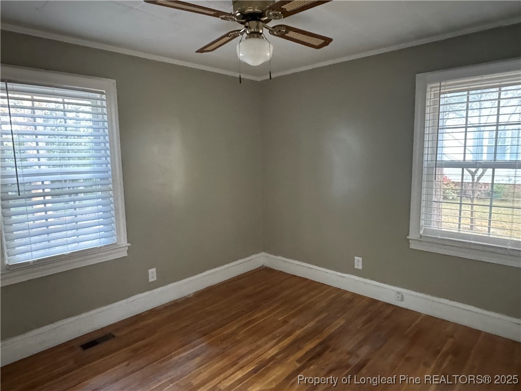 116 North Wright Street Raeford, NC 28376 - Photo 7 of 13 a view of a room with wooden floor and windows