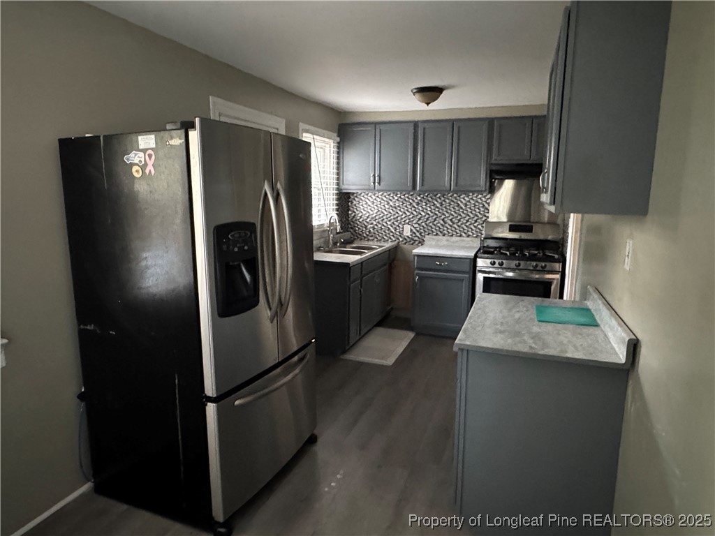 116 North Wright Street Raeford, NC 28376 - Photo 9 of 13 a kitchen with a refrigerator sink and stove