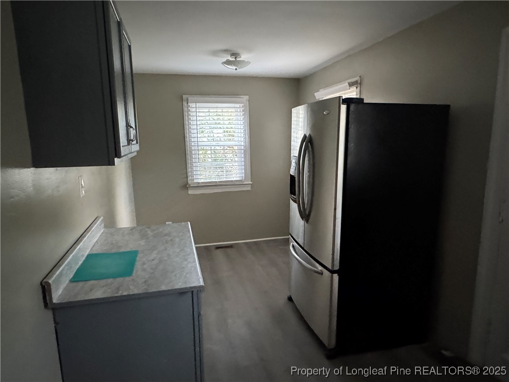 116 North Wright Street Raeford, NC 28376 - Photo 10 of 13 a kitchen with stainless steel appliances granite countertop a refrigerator a stove and a sink