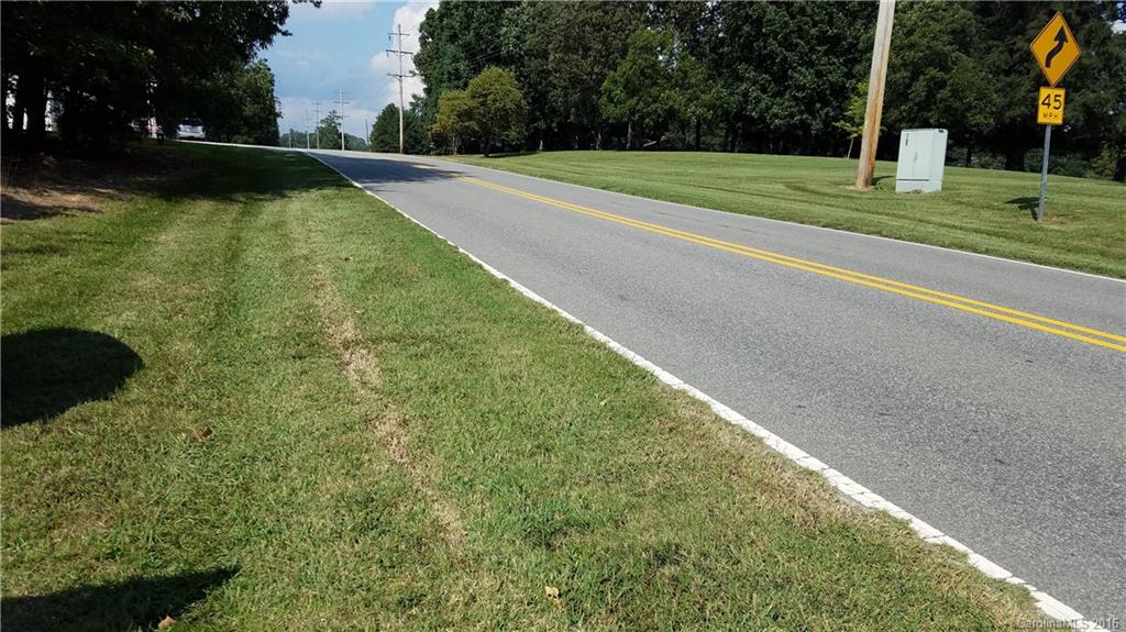 5810 Wolf Pond Road Monroe, NC 28112 - Photo 2 of 5 a view of a field with a trees