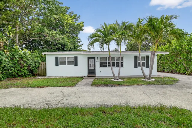 front view of a house with a yard