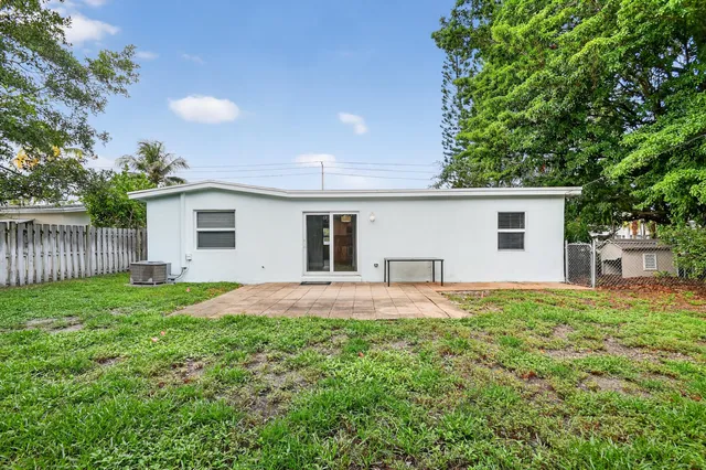 a view of a backyard with a house