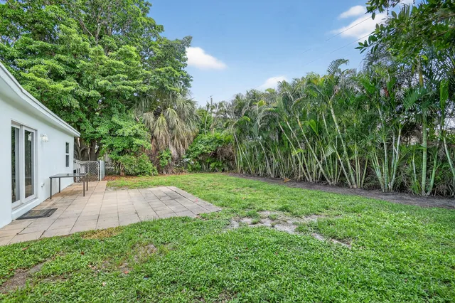 a view of backyard with green space