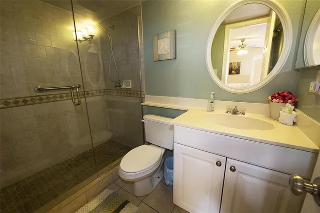a bathroom with a sink toilet and a mirror