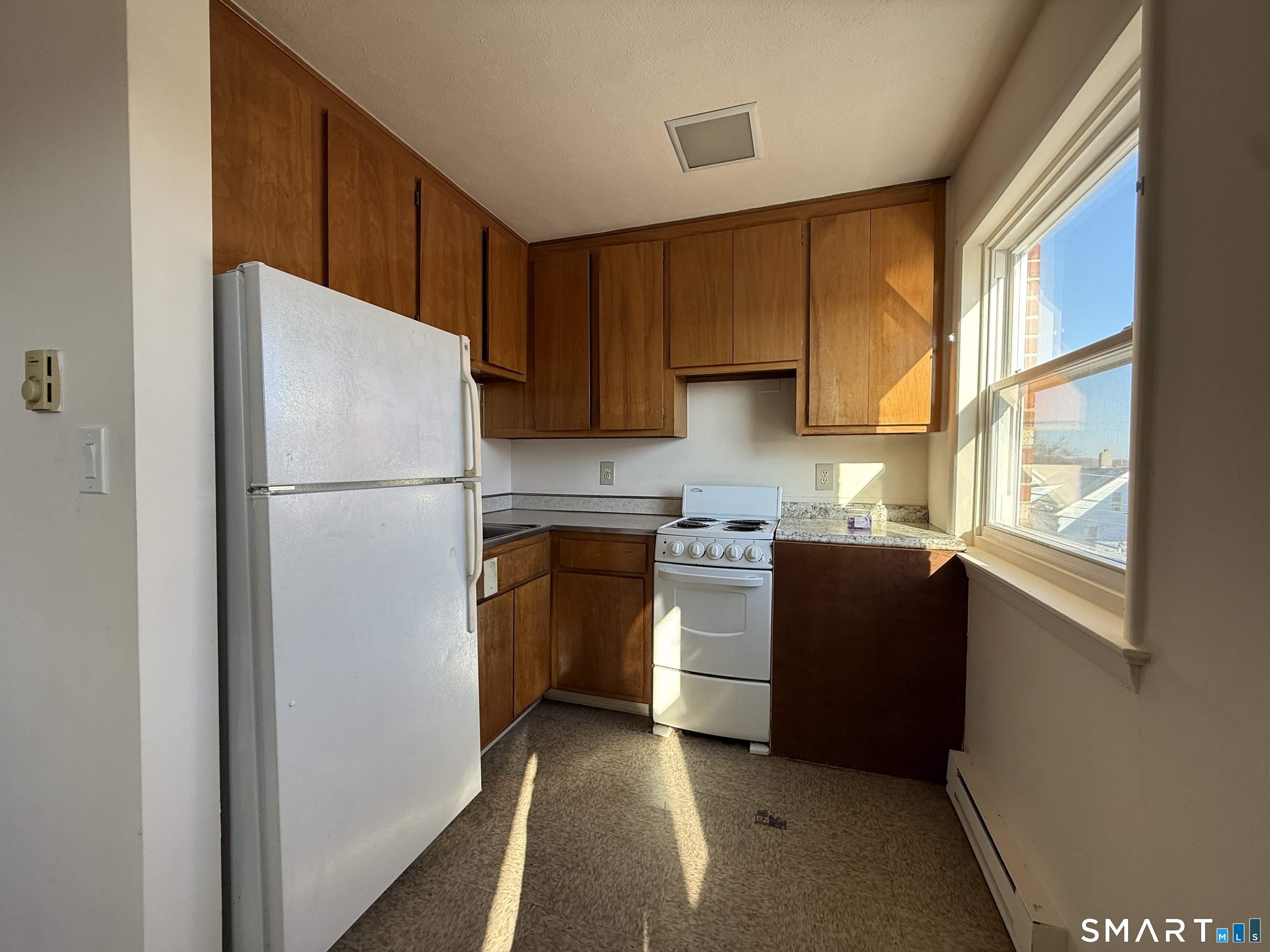 35 Beers Street, Unit 202 Bridgeport, CT 06606 - Photo 4 of 6 a kitchen with a refrigerator stove and sink