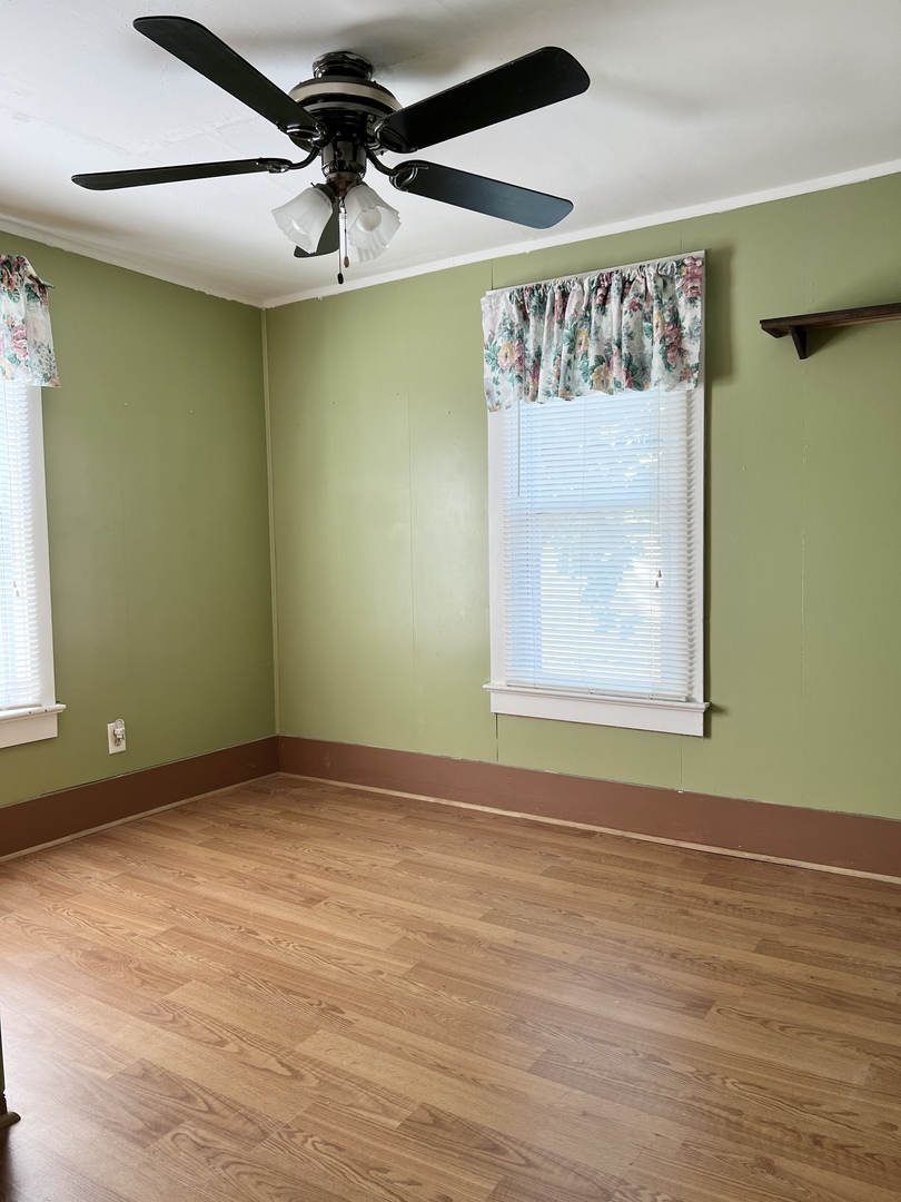 113 Wilson Avenue Chadwick, IL 61014 - Photo 12 of 19 a view of room with window and a ceiling fan