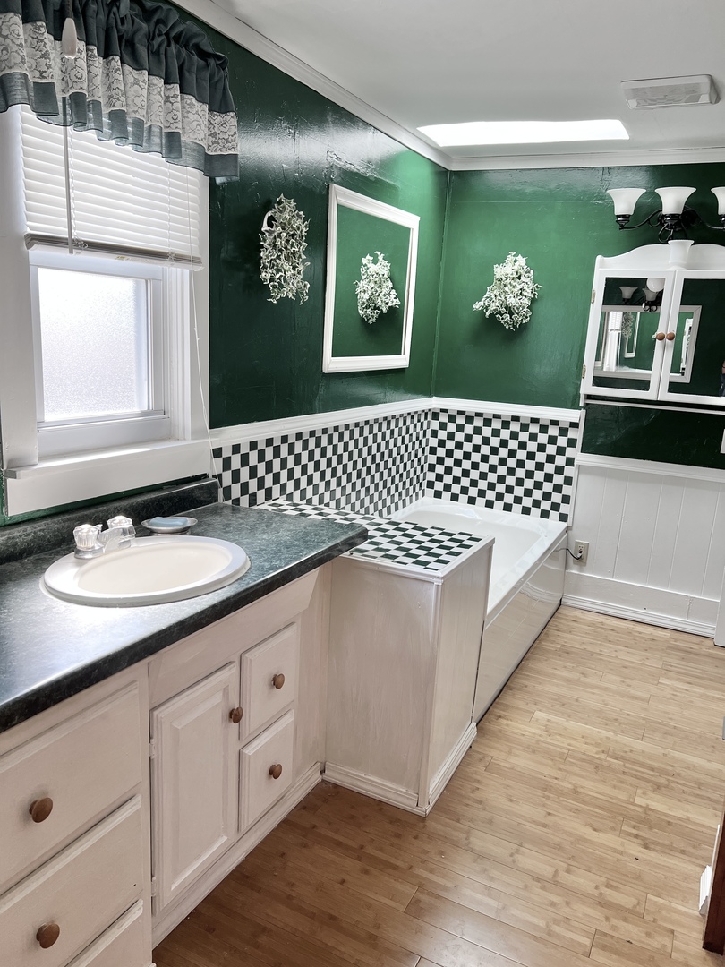 113 Wilson Avenue Chadwick, IL 61014 - Photo 14 of 19 a spacious bathroom with a granite countertop sink mirror and toilet
