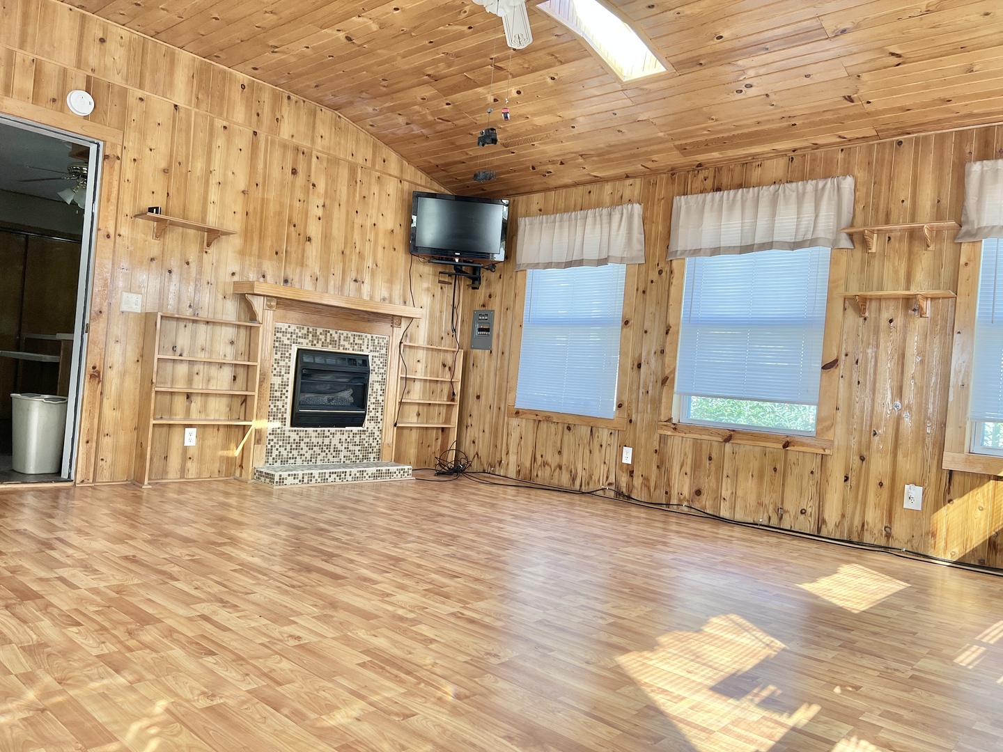 113 Wilson Avenue Chadwick, IL 61014 - Photo 2 of 19 a view of an empty room with wooden floor and a fireplace