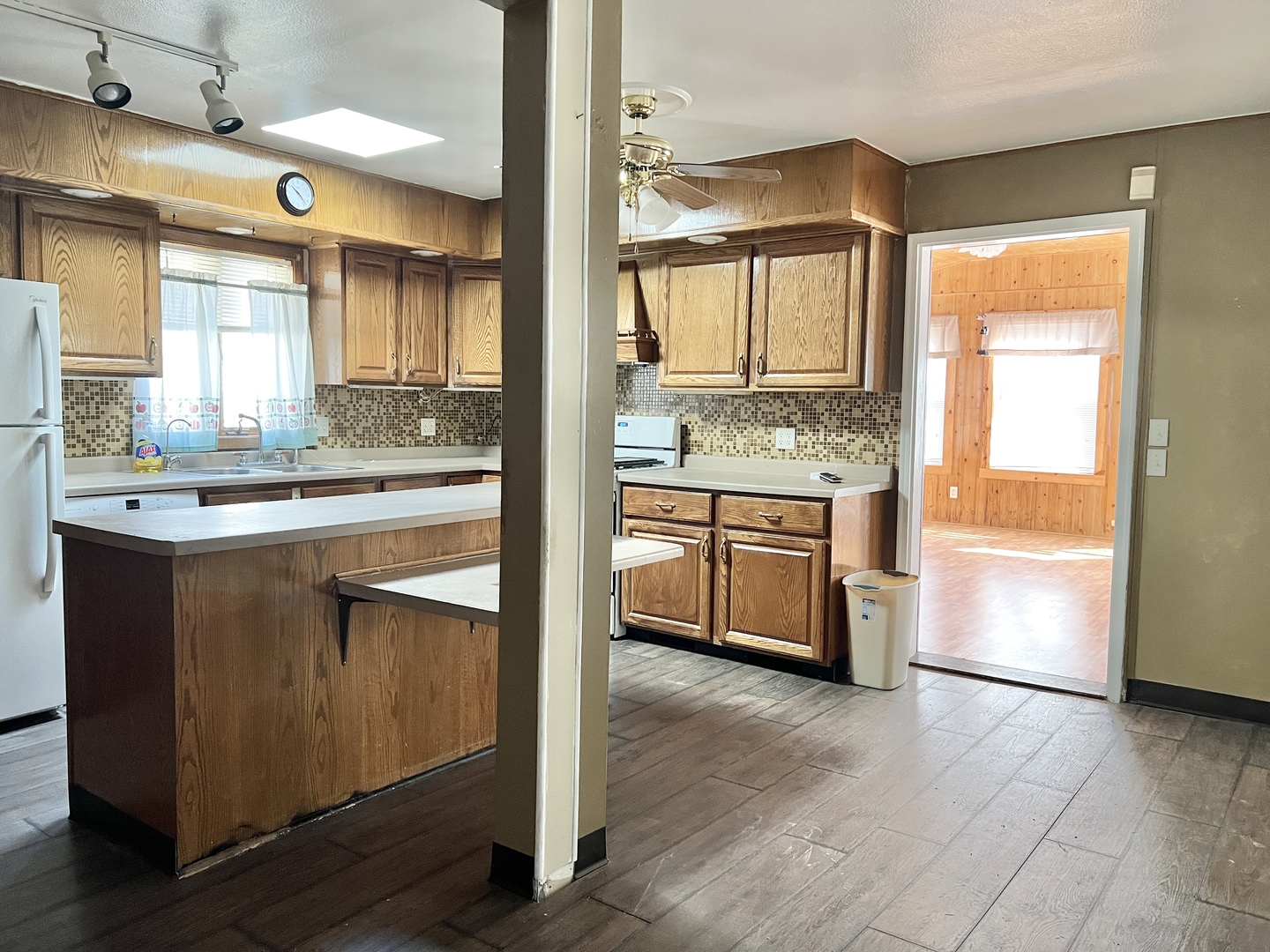 113 Wilson Avenue Chadwick, IL 61014 - Photo 4 of 19 a kitchen with stainless steel appliances granite countertop a stove a sink and a refrigerator with wooden floor
