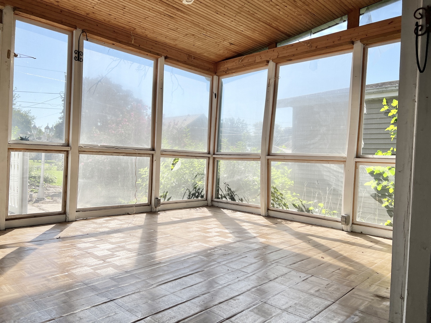 113 Wilson Avenue Chadwick, IL 61014 - Photo 5 of 19 a view of an empty room with wooden floor and a window