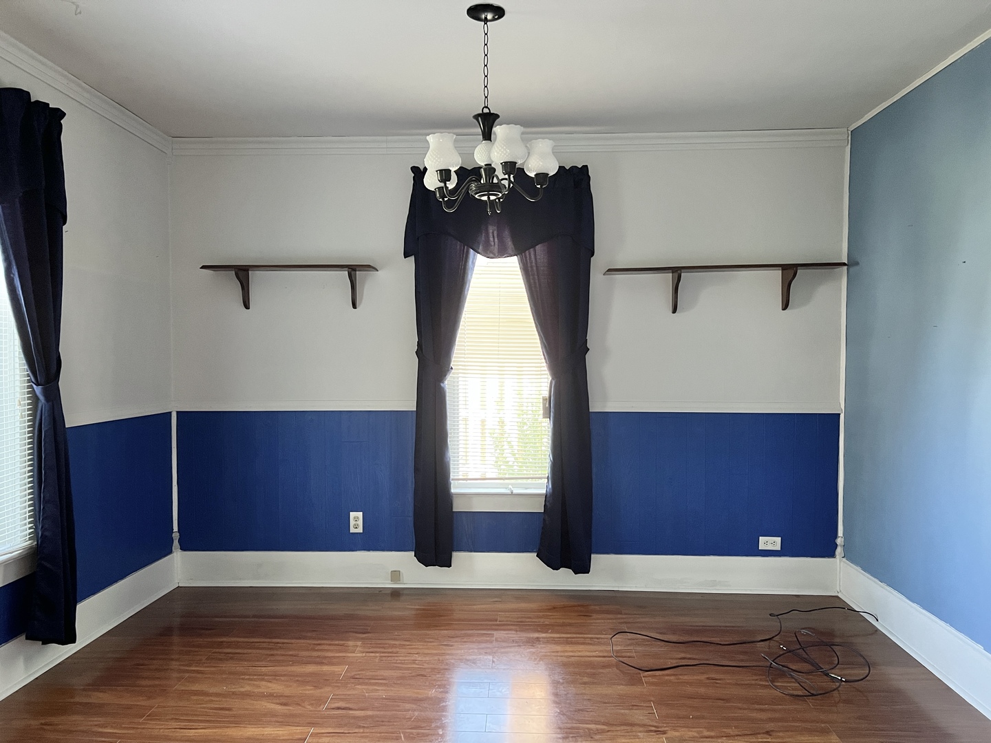 113 Wilson Avenue Chadwick, IL 61014 - Photo 9 of 19 a view of an empty room with window and wooden floor