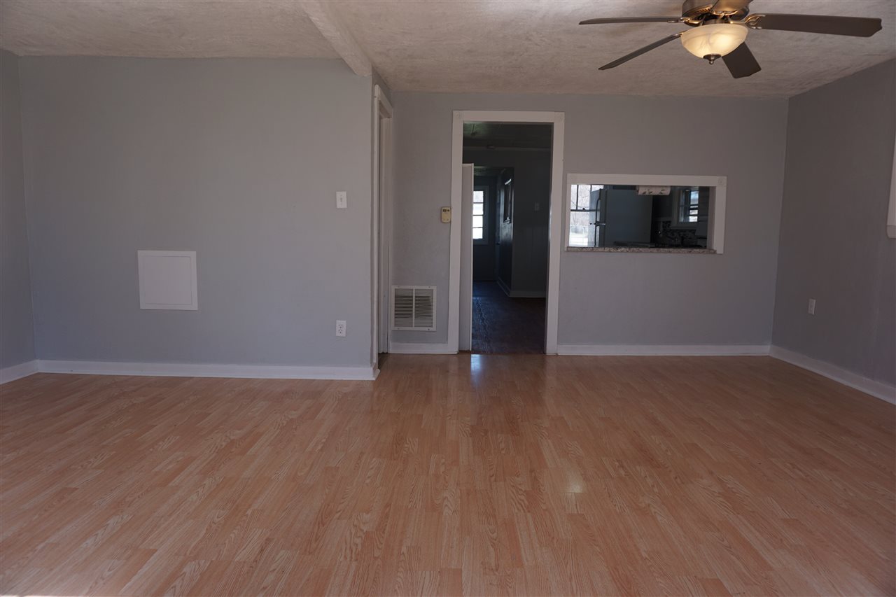 422 Fitch Road Rockford, IL 61109 - Photo 3 of 11 a view of a livingroom with wooden floor and ceiling fan