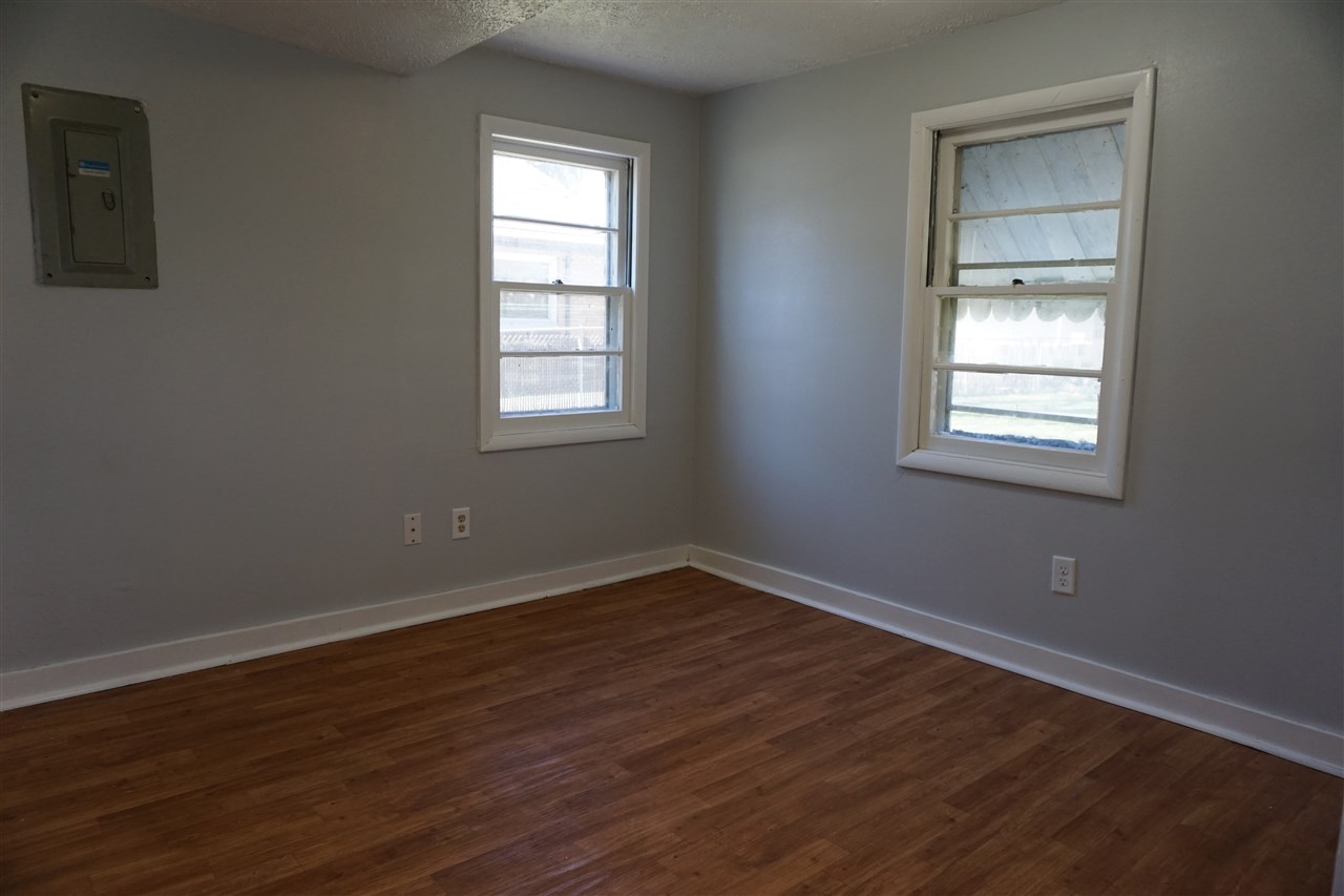 422 Fitch Road Rockford, IL 61109 - Photo 9 of 11 a view of an empty room with wooden floor and a window