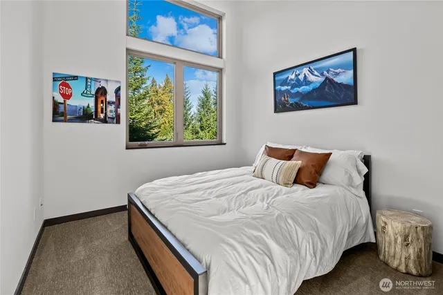 a bedroom with bed and a window