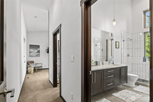 a en suite bathroom with a sink double vanity and a shower