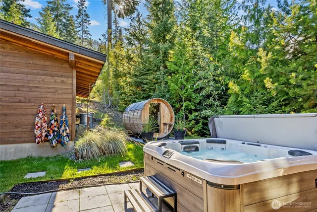 a view of a chairs and table in the backyard