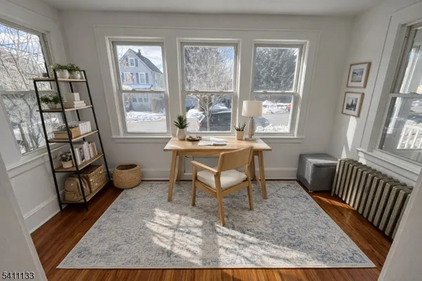 a workspace with furniture and a window