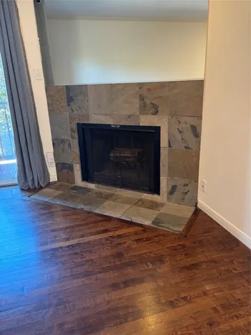 a view of balcony with wooden floor
