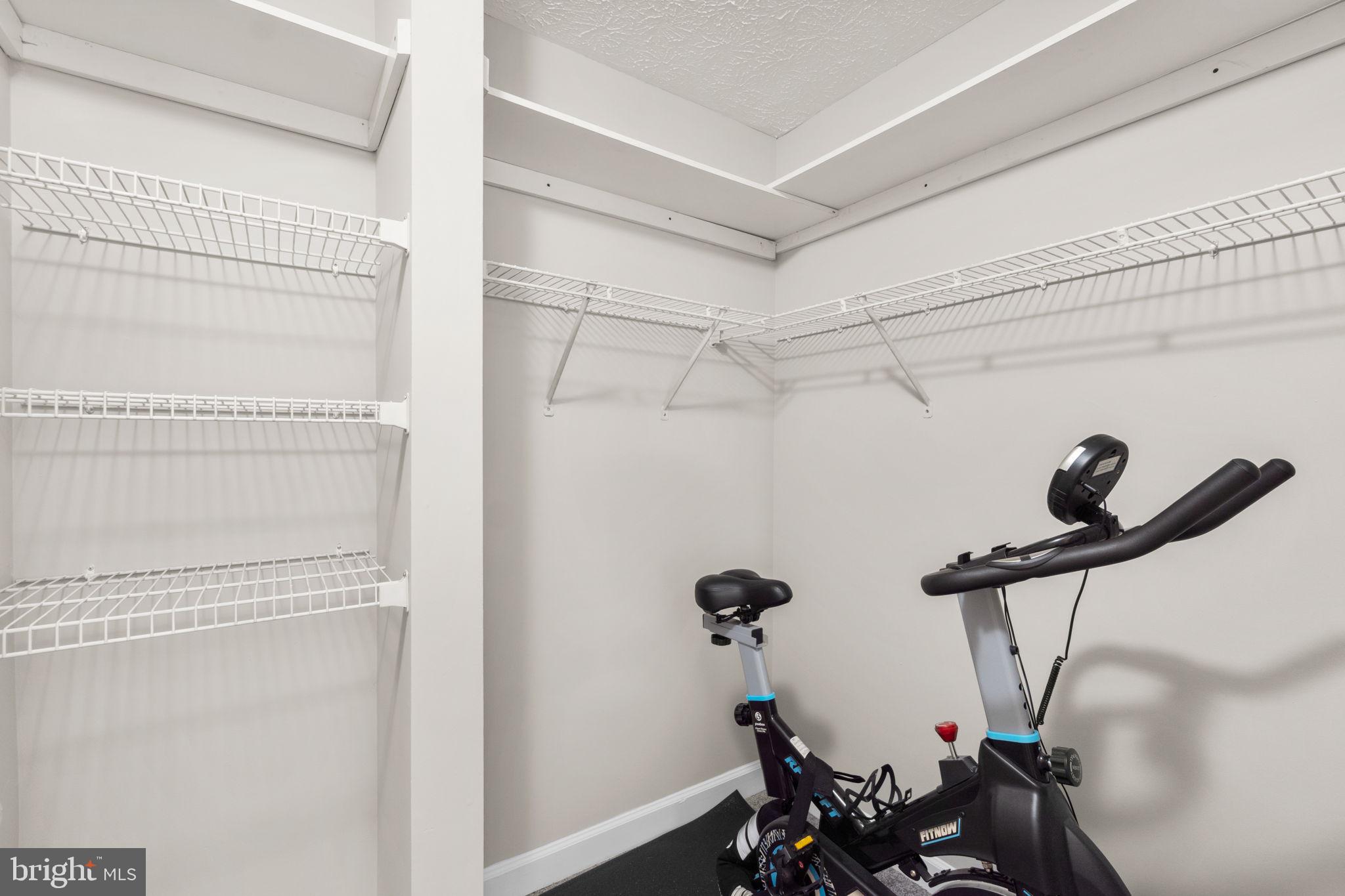 6509 Springwater Court, Unit 6303 Frederick, MD 21701 - Photo 23 of 48 a view of a room with gym equipment