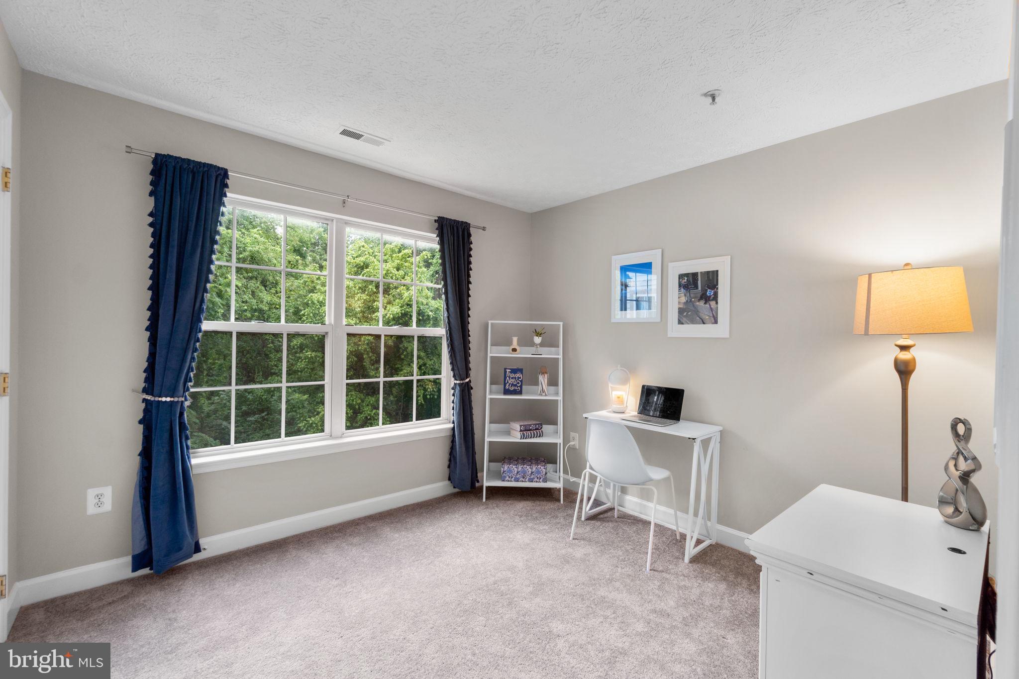 6509 Springwater Court, Unit 6303 Frederick, MD 21701 - Photo 24 of 48 a view of a livingroom with furniture and a window