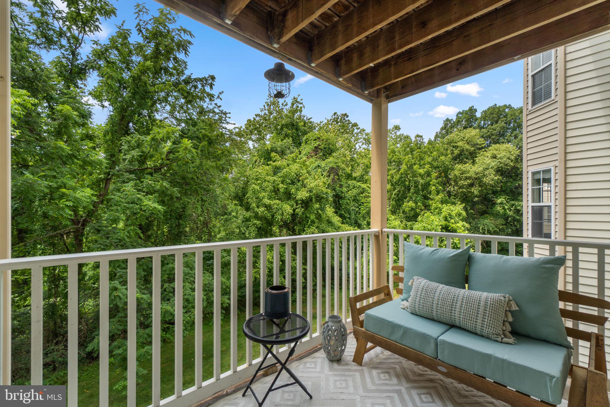 6509 Springwater Court, Unit 6303 Frederick, MD 21701 - Photo 29 of 48 a balcony with wooden floor in outdoor space