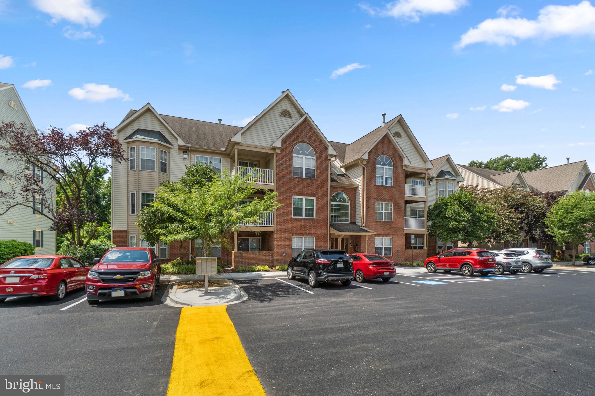 6509 Springwater Court, Unit 6303 Frederick, MD 21701 - Photo 3 of 48 a view of a cars parked in front of a house