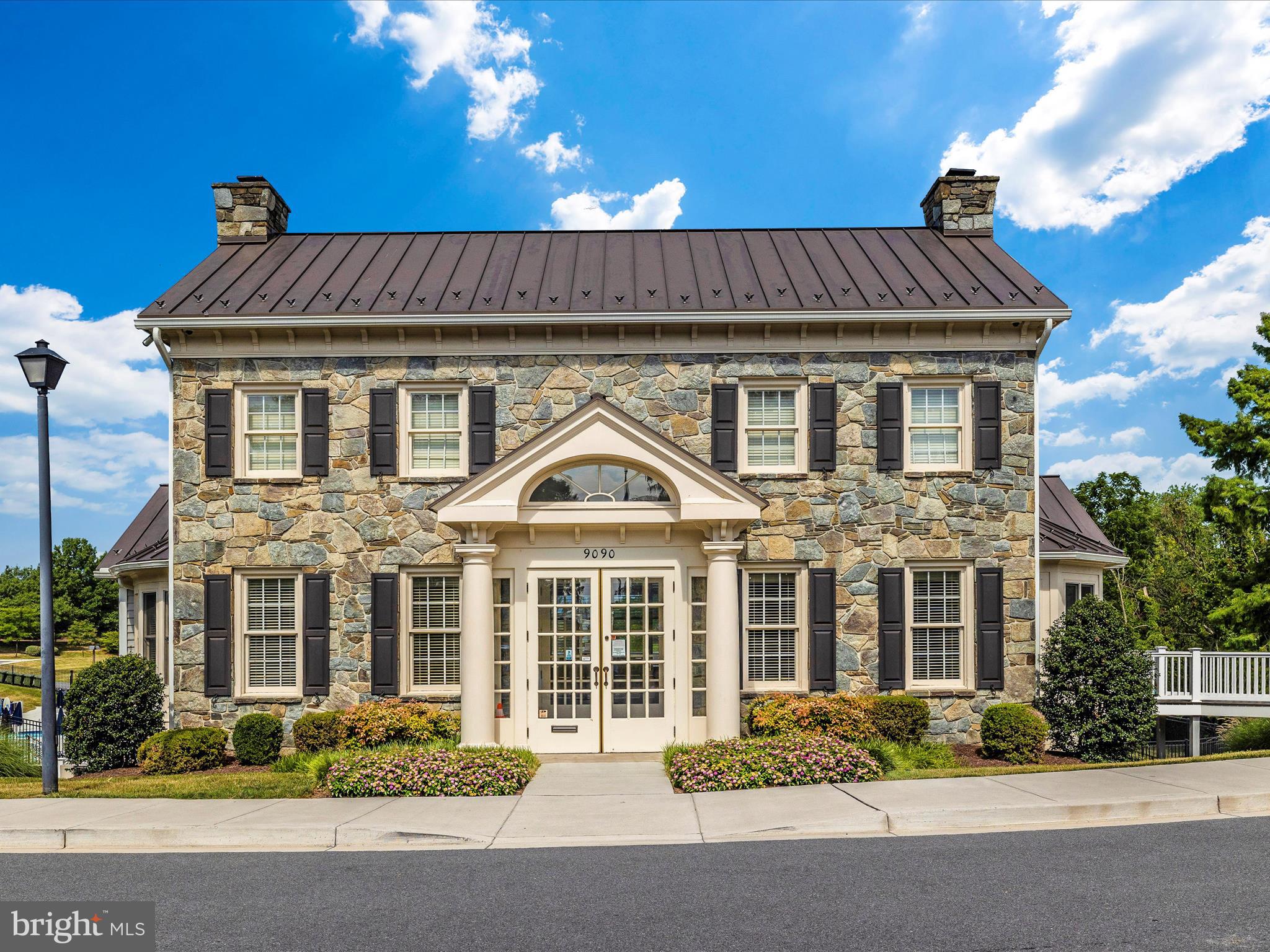 6509 Springwater Court, Unit 6303 Frederick, MD 21701 - Photo 32 of 48 a front view of a house with a yard