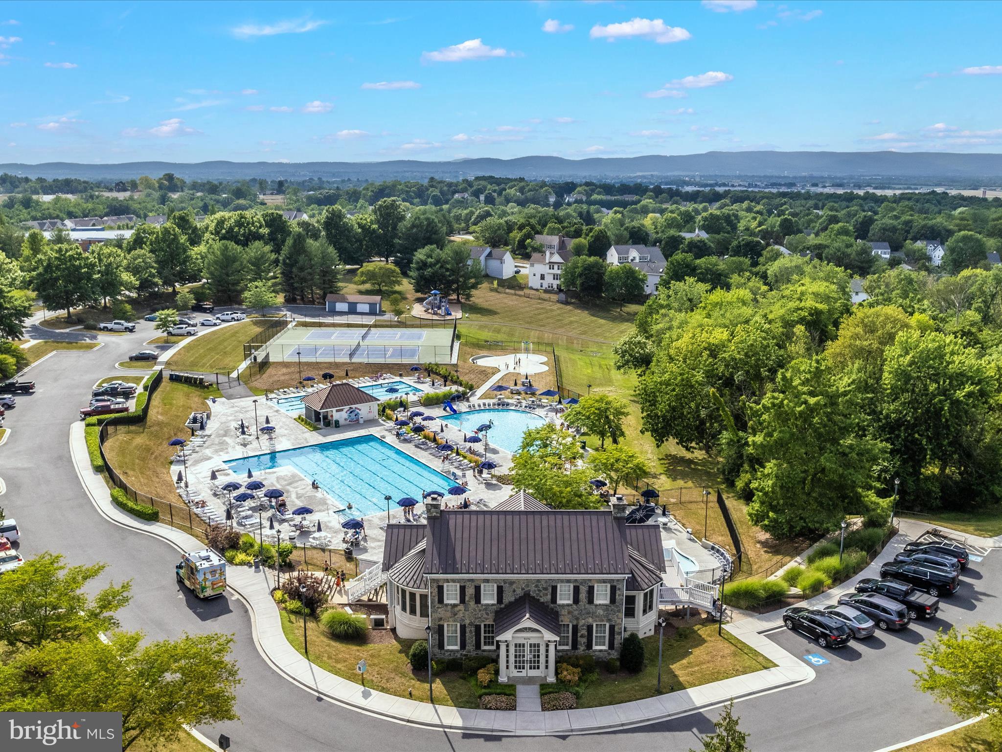 6509 Springwater Court, Unit 6303 Frederick, MD 21701 - Photo 34 of 48 a view of a swimming pool with a patio