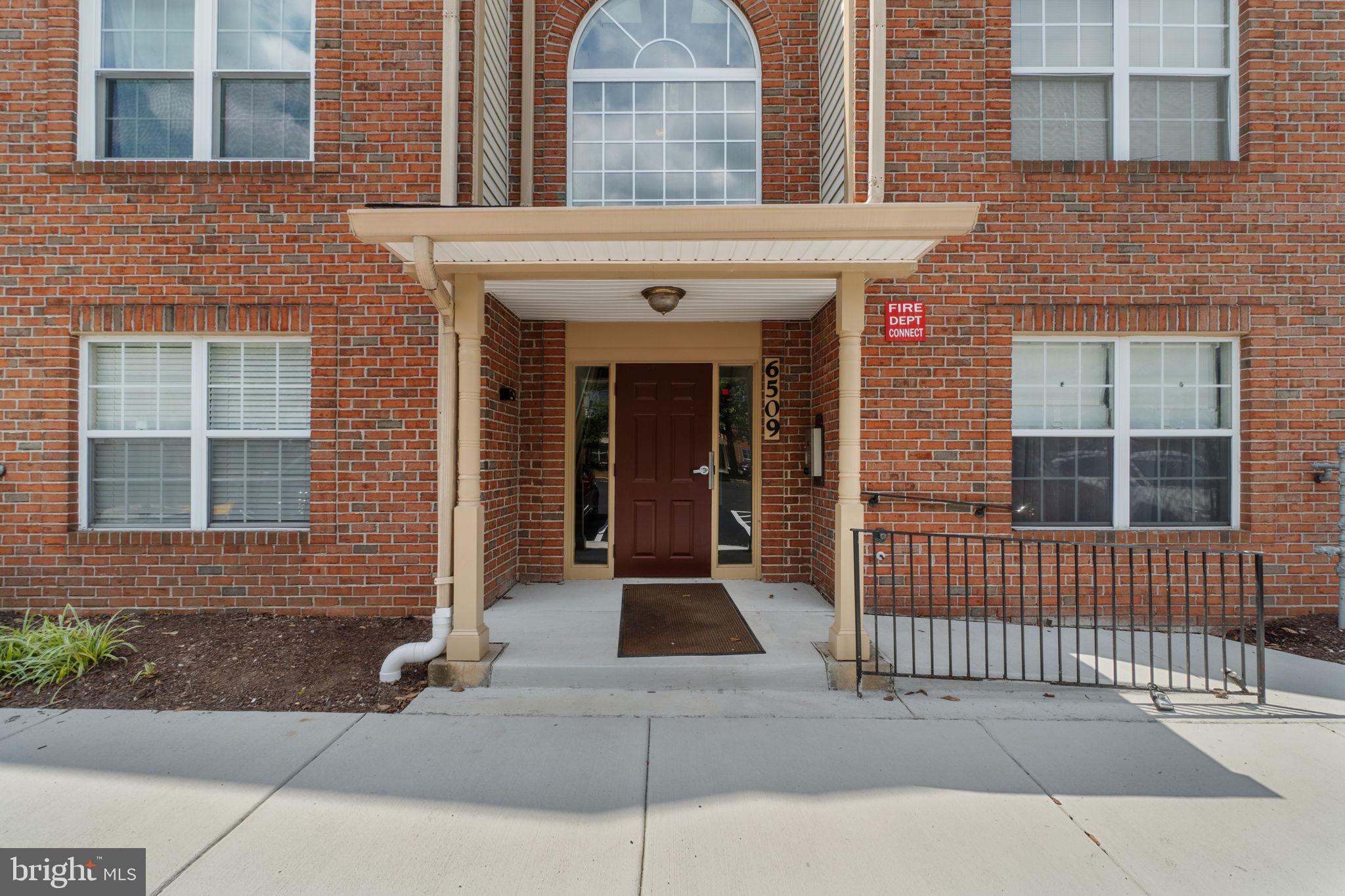 6509 Springwater Court, Unit 6303 Frederick, MD 21701 - Photo 4 of 48 a view of a brick house with large windows