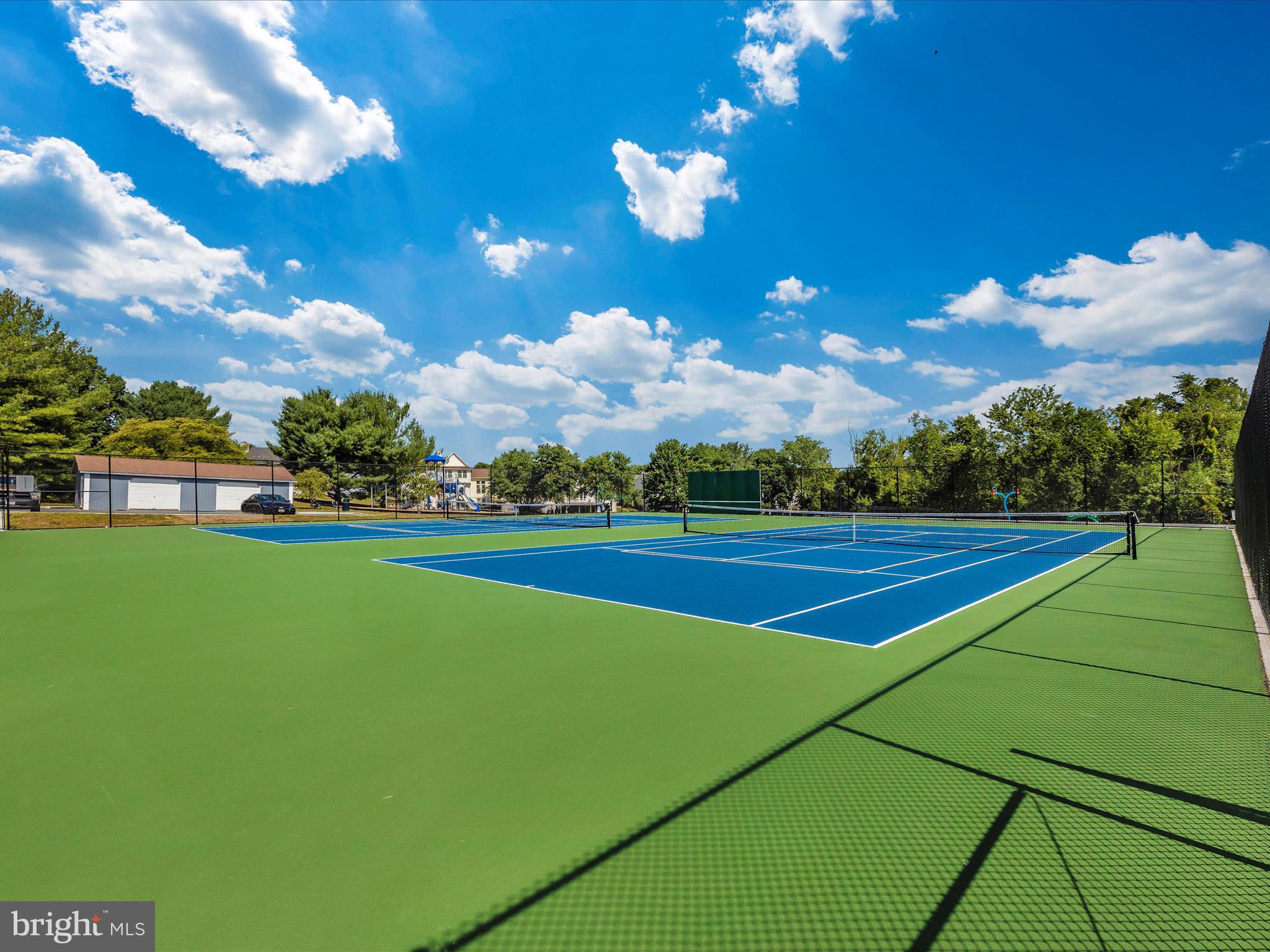 6509 Springwater Court, Unit 6303 Frederick, MD 21701 - Photo 44 of 48 a view of a golf course with a lake
