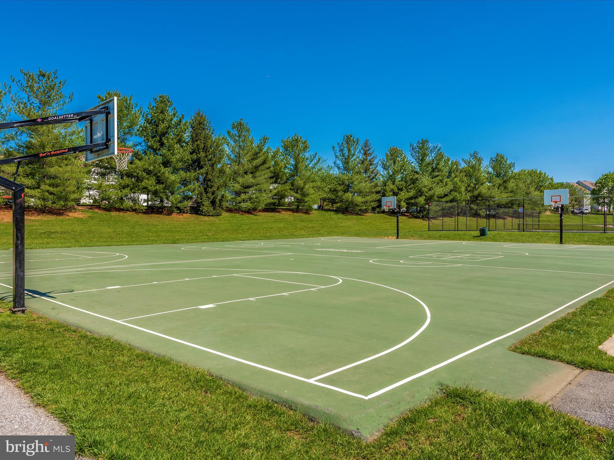 6509 Springwater Court, Unit 6303 Frederick, MD 21701 - Photo 46 of 48 a view of a tennis court