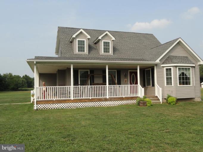 8235 Detour Road Denton, MD 21629 - Photo 2 of 30 a front view of a house with a garden