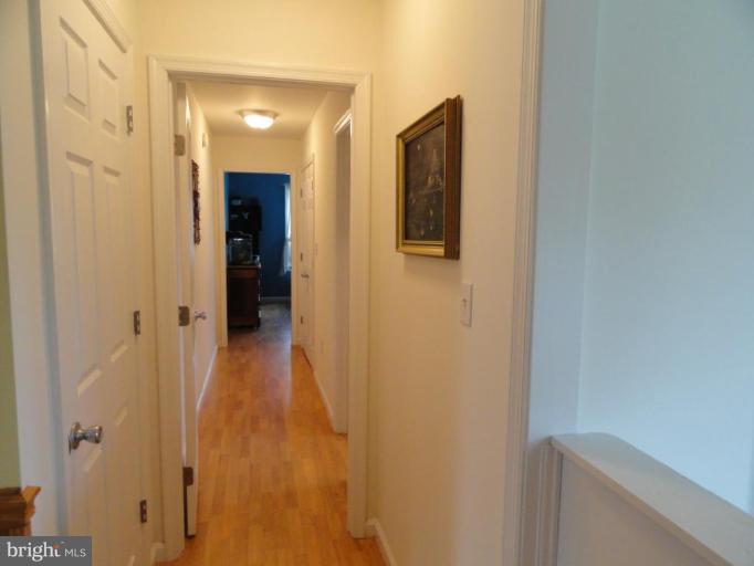 8235 Detour Road Denton, MD 21629 - Photo 12 of 30 a view of a hallway with wooden floor