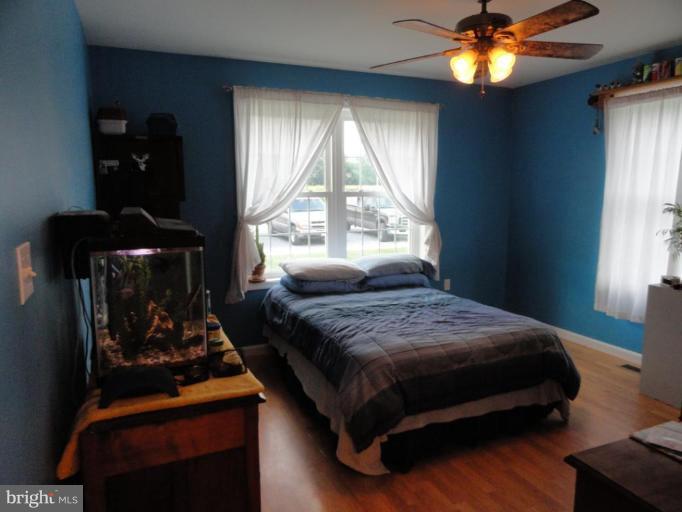 8235 Detour Road Denton, MD 21629 - Photo 15 of 30 a bedroom with a bed and a window