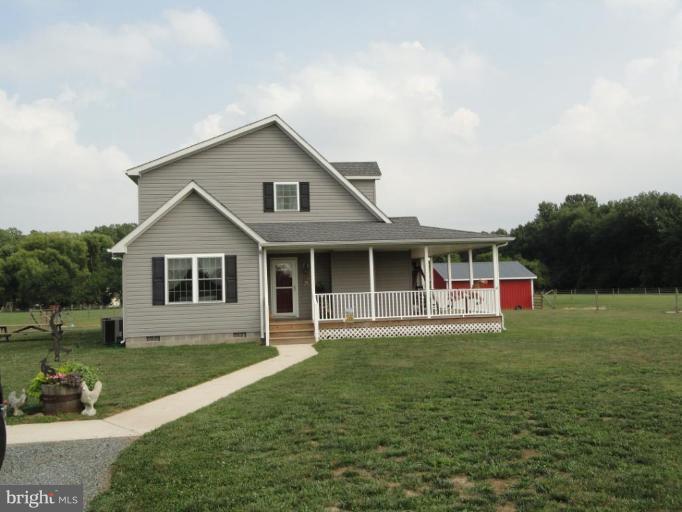 8235 Detour Road Denton, MD 21629 - Photo 3 of 30 a front view of a house with a yard