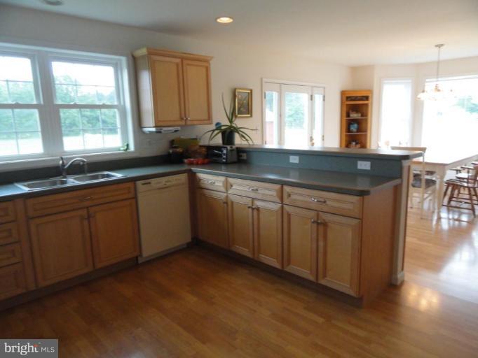 8235 Detour Road Denton, MD 21629 - Photo 6 of 30 a kitchen with a sink cabinets and window