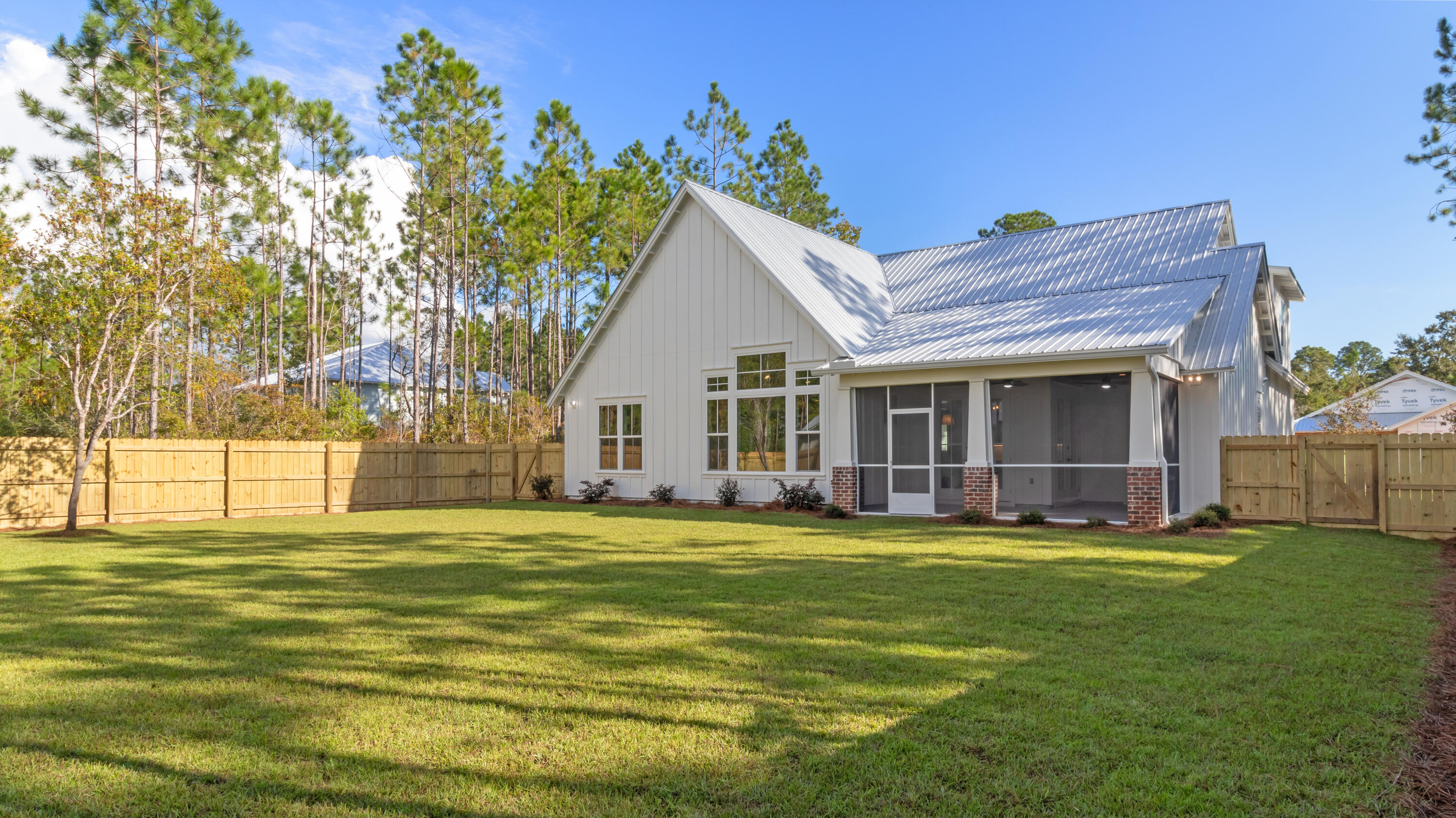 80 Muzzle Street Freeport, FL 32439 - Photo 15 of 71 a view of a house with a yard and sitting area