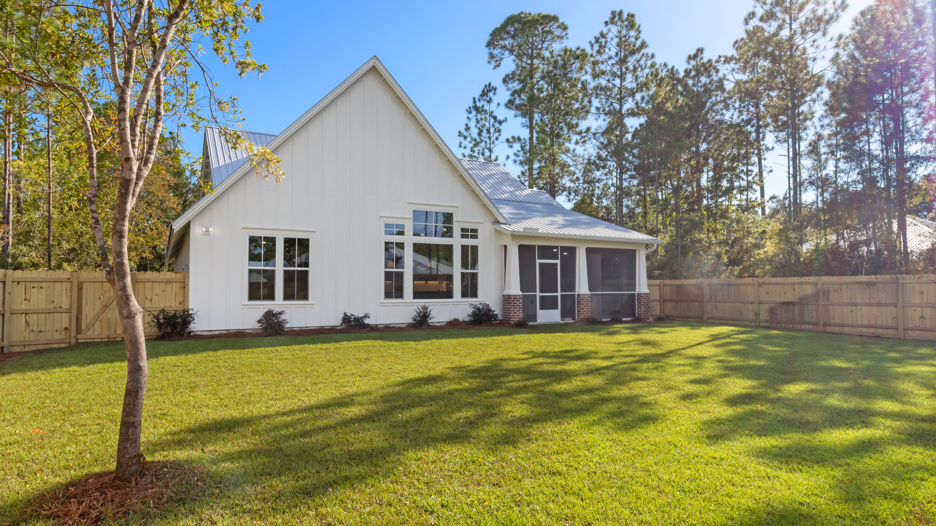 80 Muzzle Street Freeport, FL 32439 - Photo 16 of 71 a view of a house with a yard and swimming pool