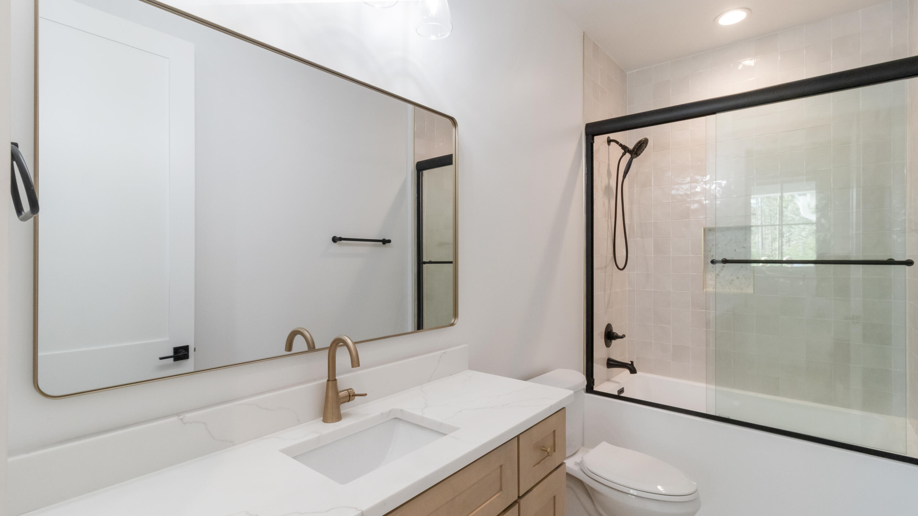 80 Muzzle Street Freeport, FL 32439 - Photo 28 of 71 a bathroom with a sink toilet and shower