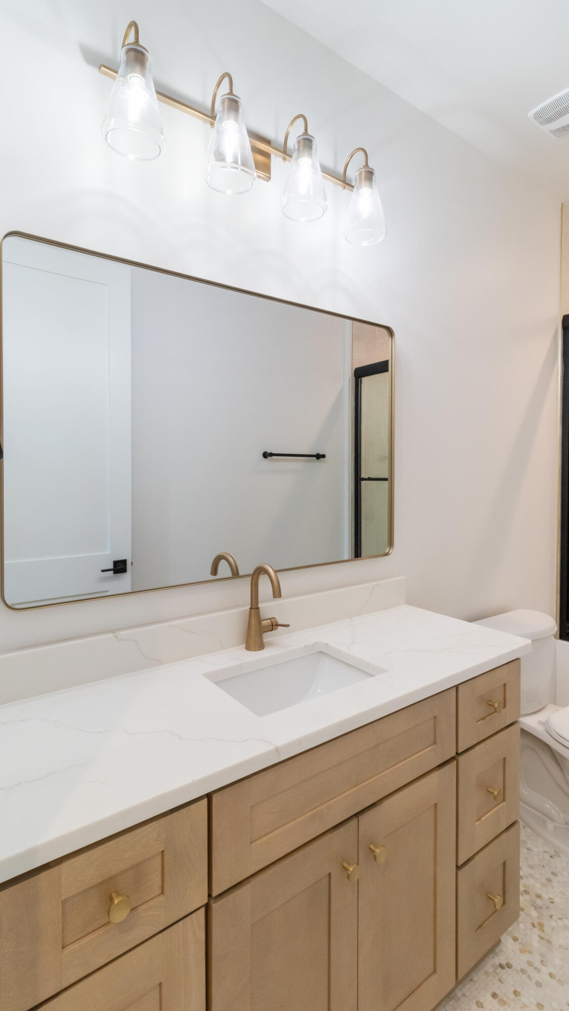 80 Muzzle Street Freeport, FL 32439 - Photo 29 of 71 a bathroom with a sink and a mirror