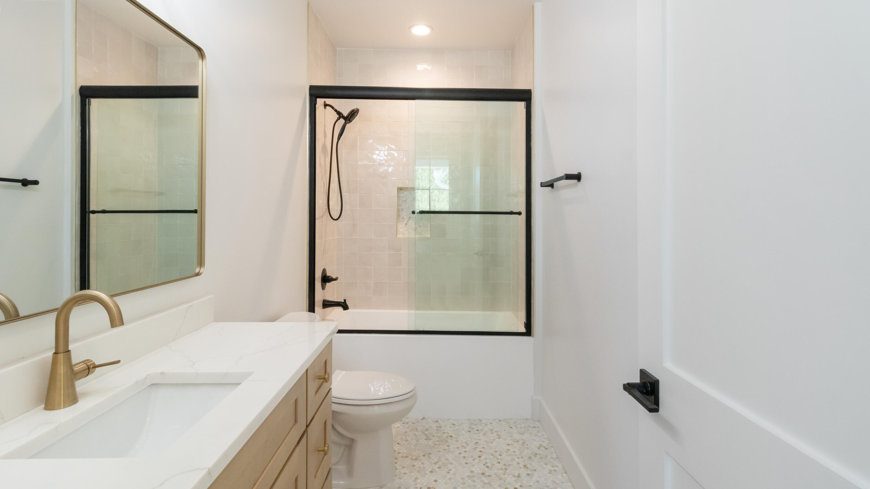 80 Muzzle Street Freeport, FL 32439 - Photo 30 of 71 a bathroom with a sink toilet and shower