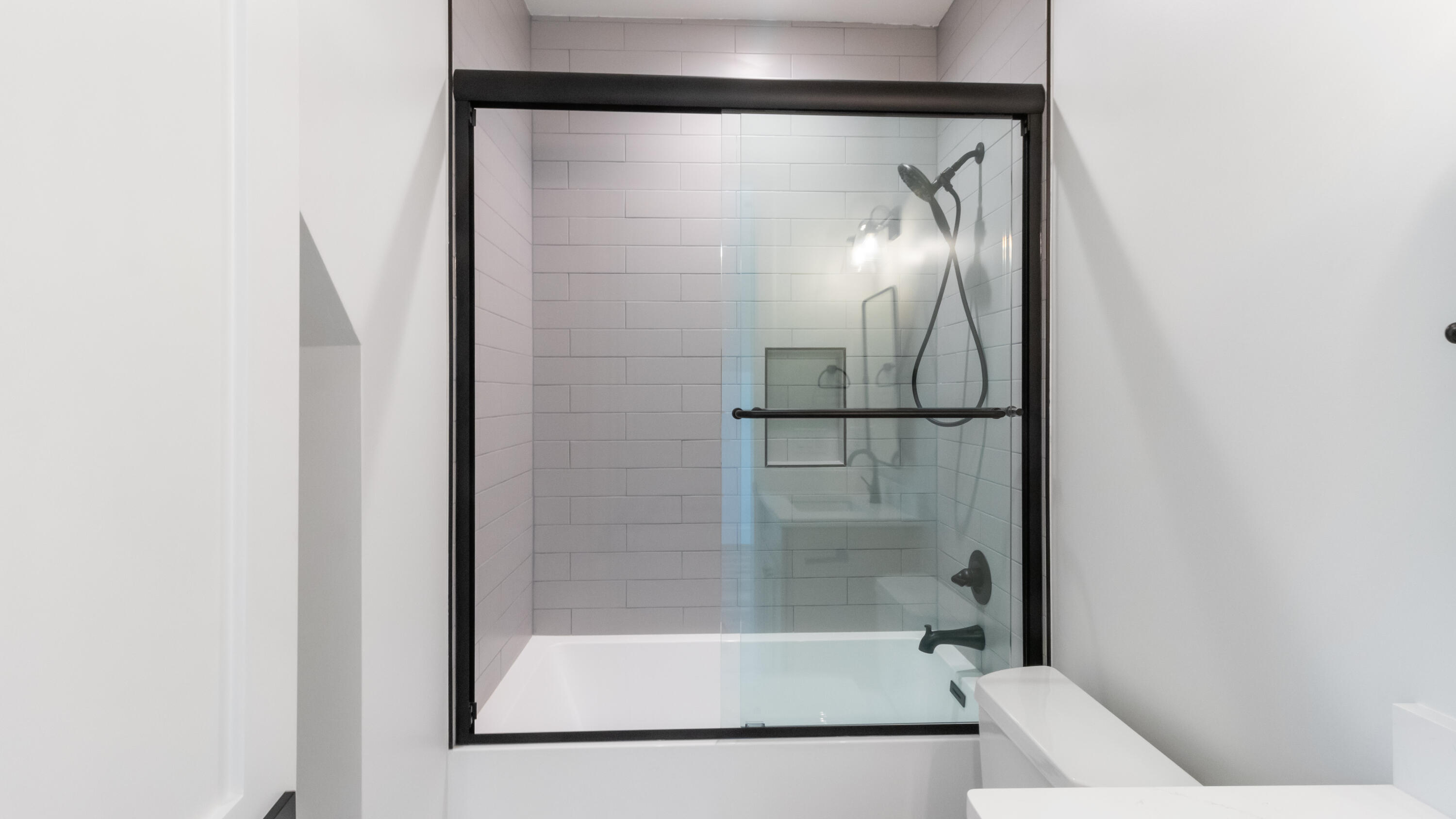 80 Muzzle Street Freeport, FL 32439 - Photo 36 of 71 a bathroom with a glass shower door