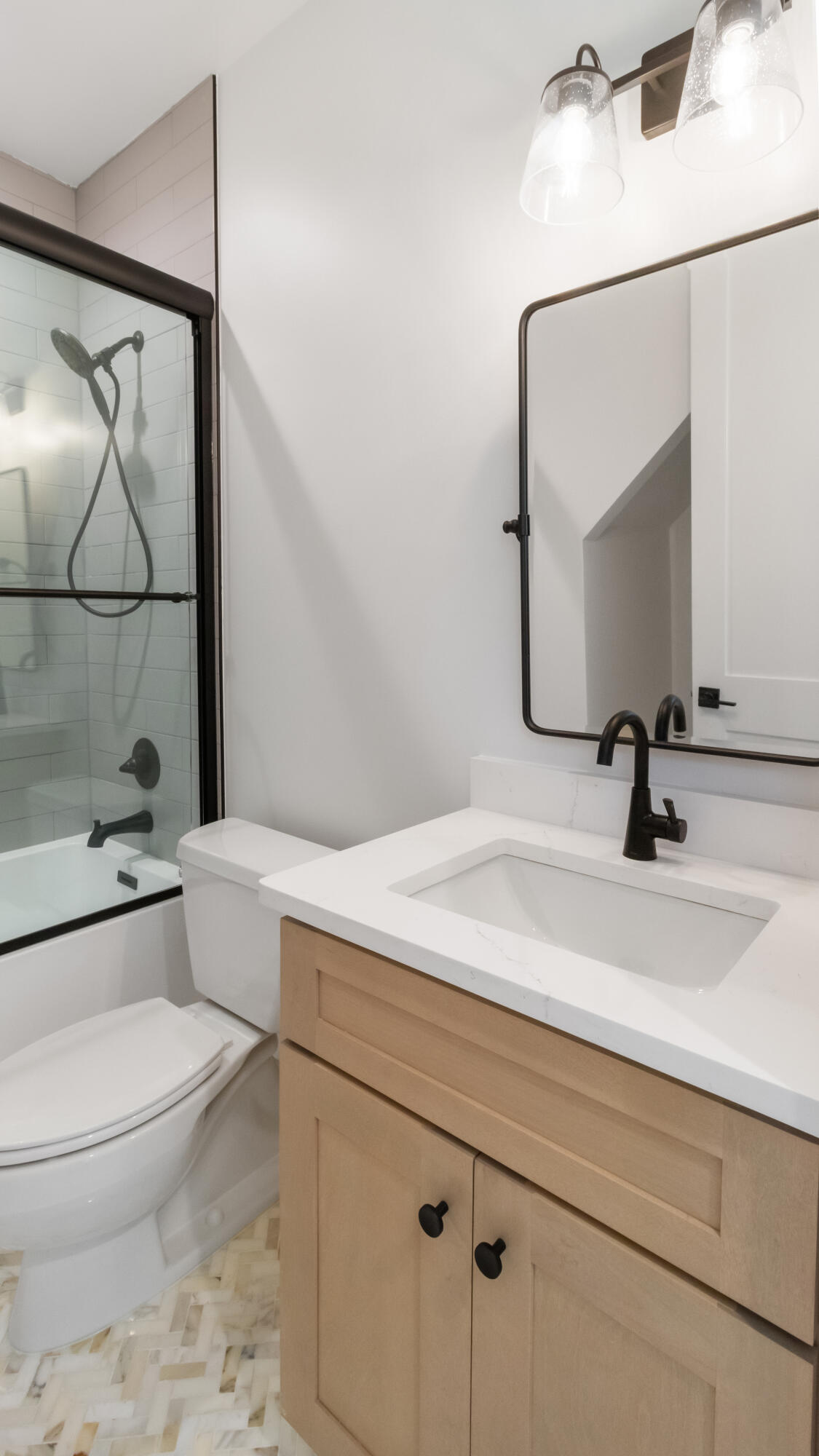 80 Muzzle Street Freeport, FL 32439 - Photo 38 of 71 a bathroom with a sink a toilet and a mirror