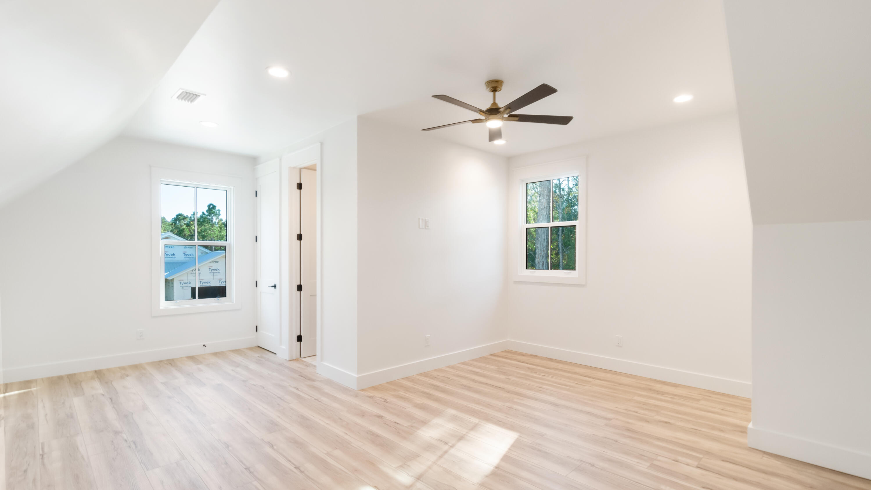 80 Muzzle Street Freeport, FL 32439 - Photo 42 of 71 a view of empty room with wooden floor and fan