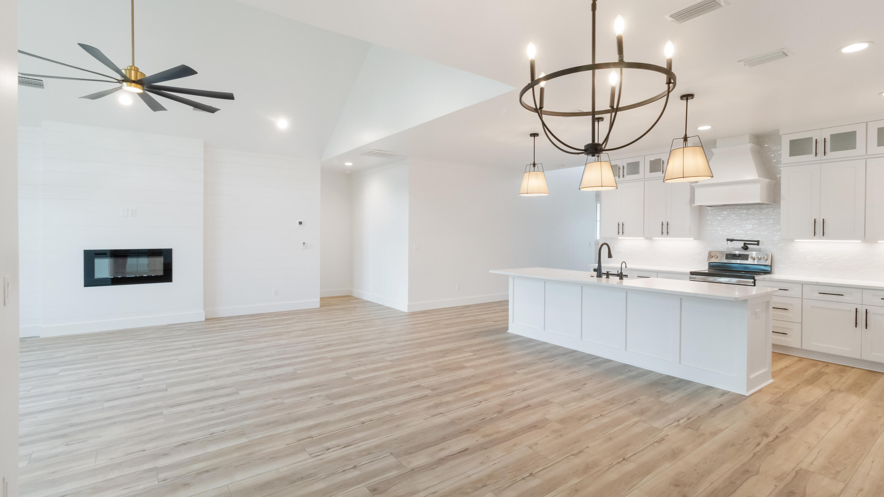 80 Muzzle Street Freeport, FL 32439 - Photo 47 of 71 a view of a kitchen with a sink and dishwasher a refrigerator with wooden floor