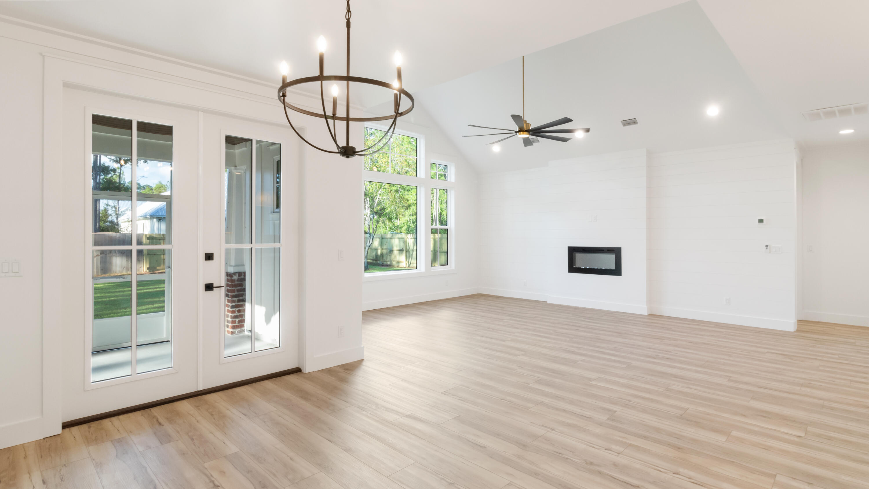 80 Muzzle Street Freeport, FL 32439 - Photo 53 of 71 a view of empty room with wooden floor and fan