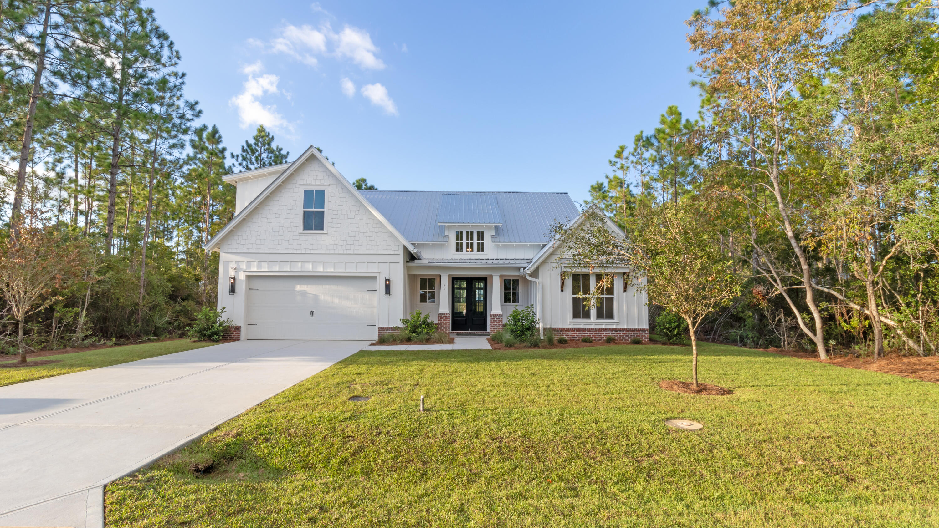 80 Muzzle Street Freeport, FL 32439 - Photo 61 of 71 a front view of a house with a yard
