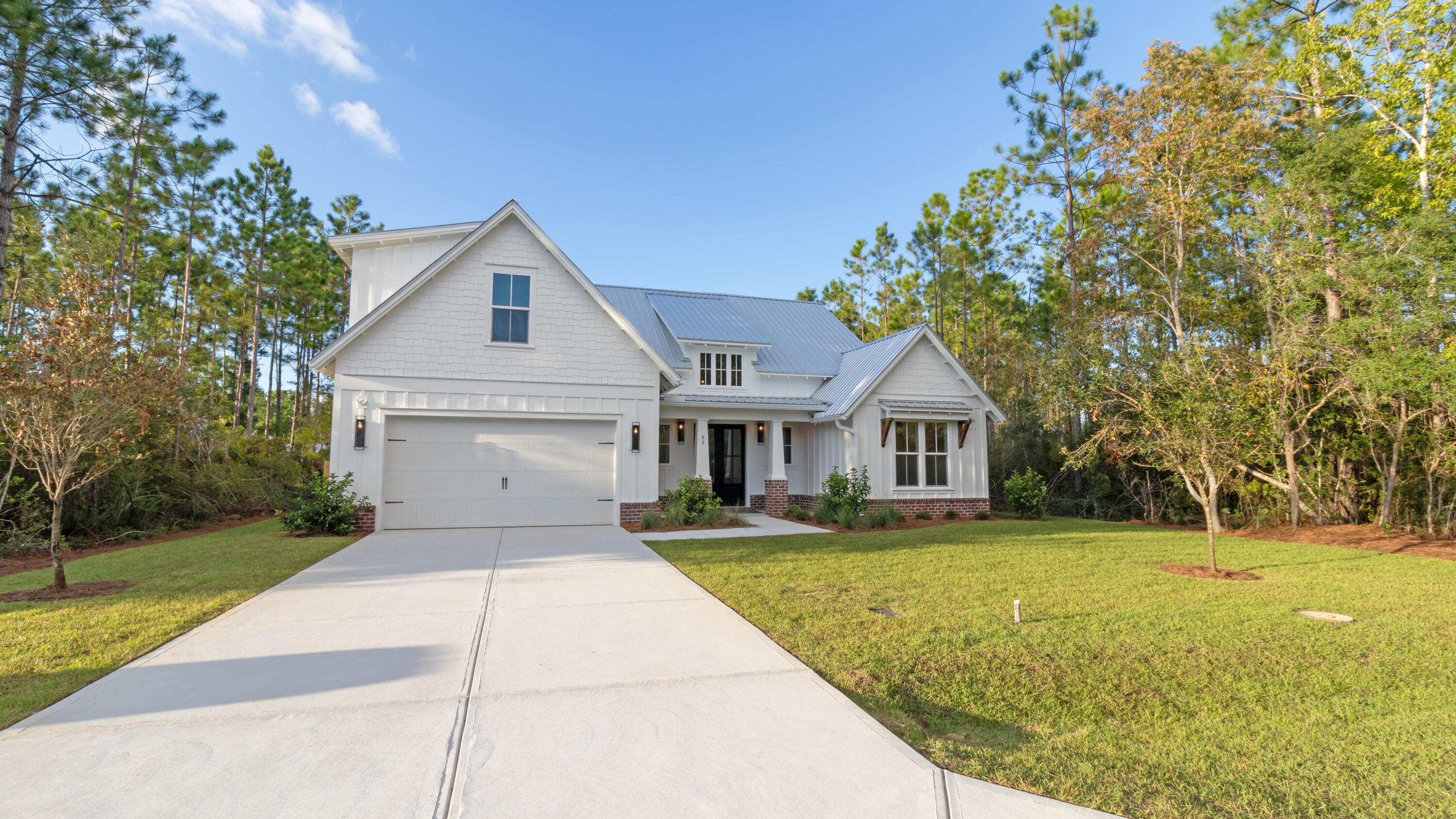 80 Muzzle Street Freeport, FL 32439 - Photo 62 of 71 a front view of a house with a yard